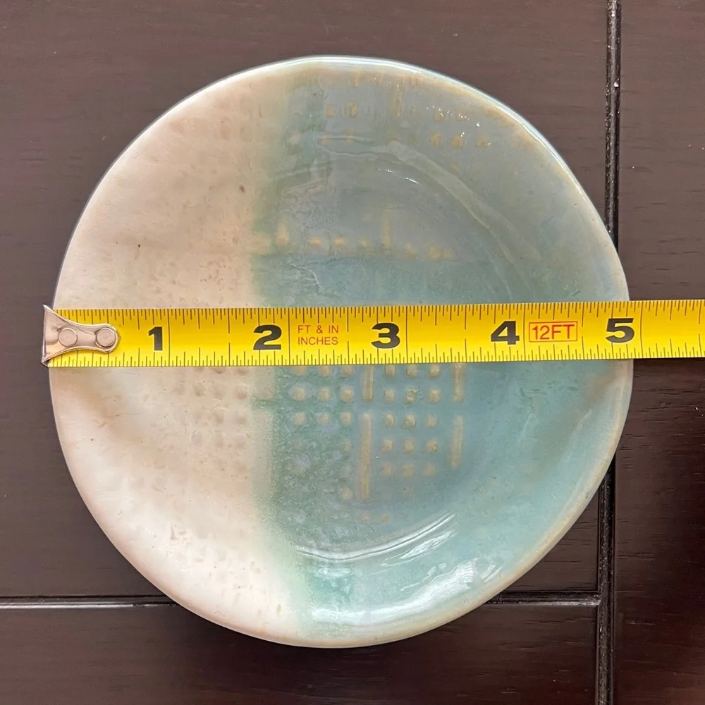 Elegant Pottery Dish with Blue and Cream Design